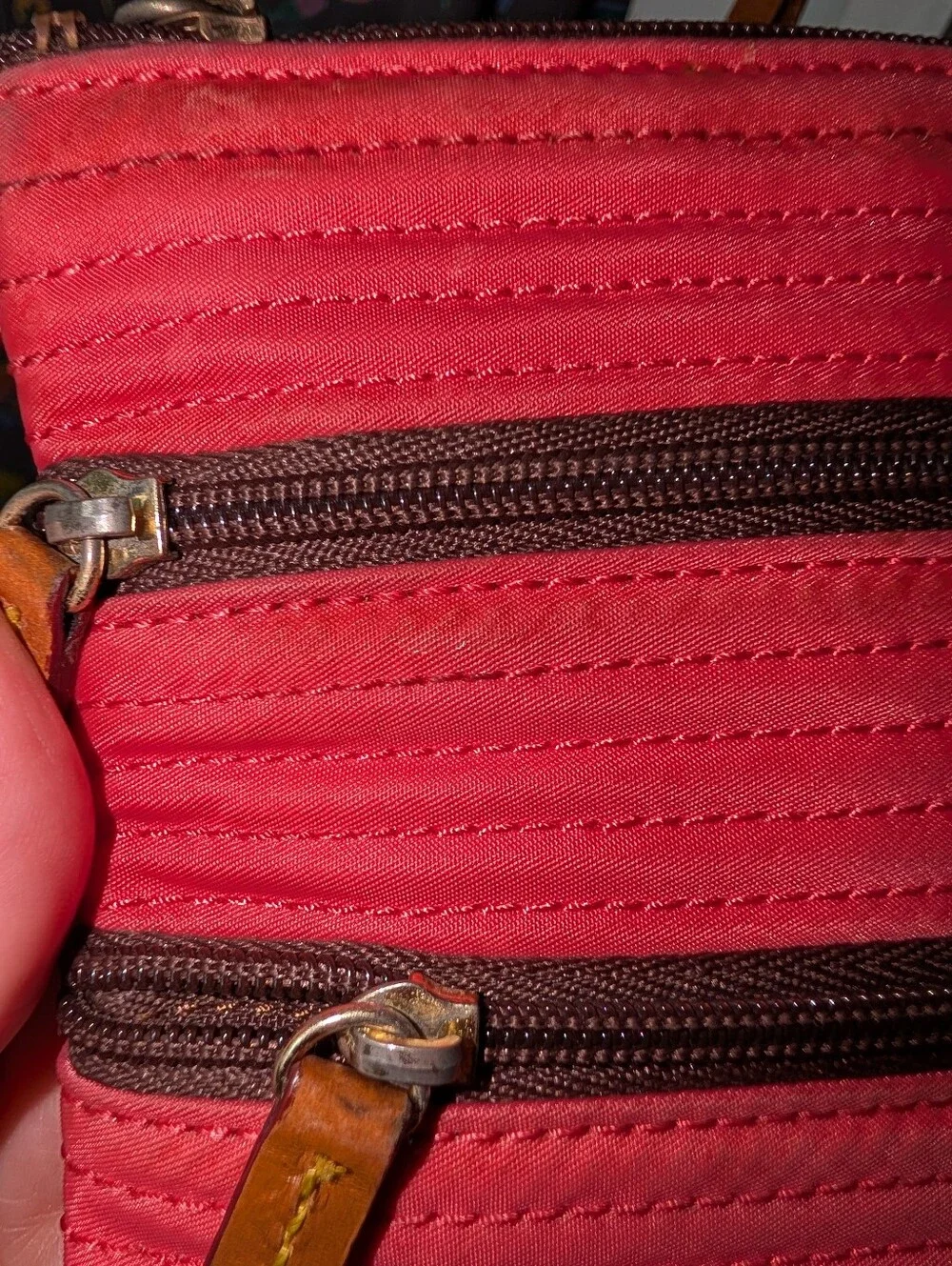 Hot pink Dooney & Bourke Nylon Triple Zip crossbody bag